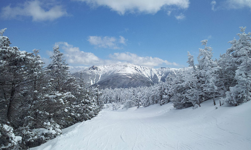 Cannon Mountain ski winter shot of Layfayette covered in snow blue sky