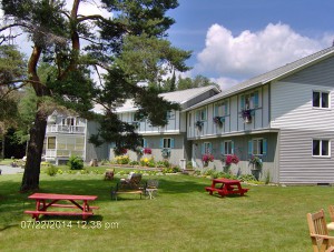Front yard Carlson's Lodge lawn chairs picnic tables benches sunny summer relaxation